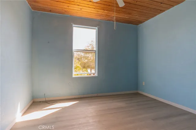 a bathroom with a sink mirror and toilet