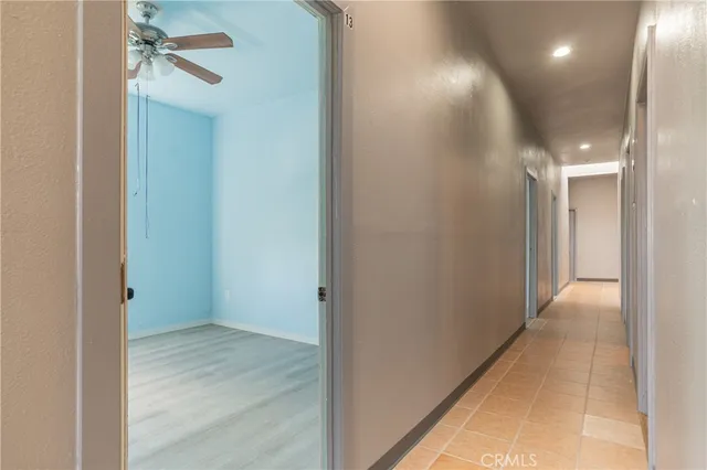 a bathroom with a shower and a glass door
