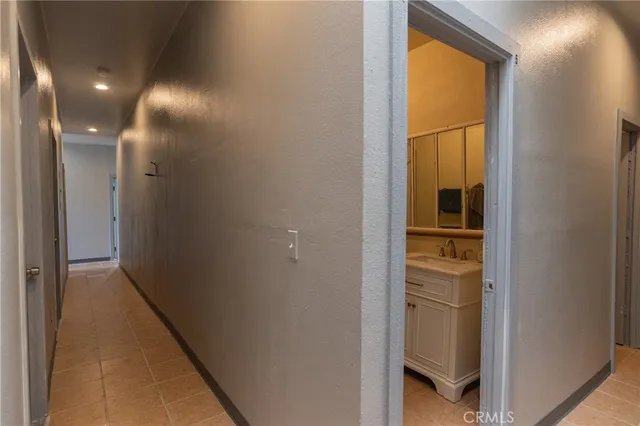 a view of a balcony with wooden floor and bench
