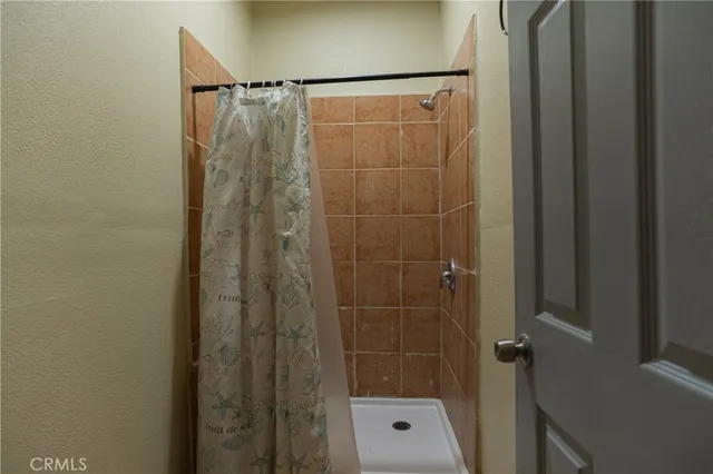 a view of empty room with floor to ceiling window