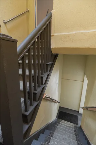 an aerial view of a house with a garden and lake view