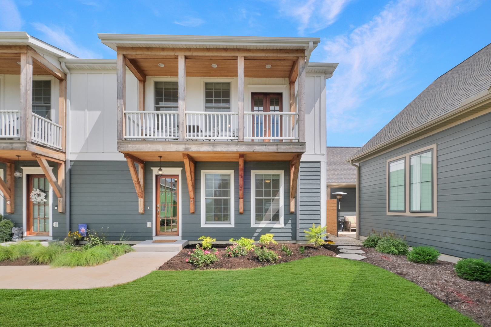 a front view of a house with garden