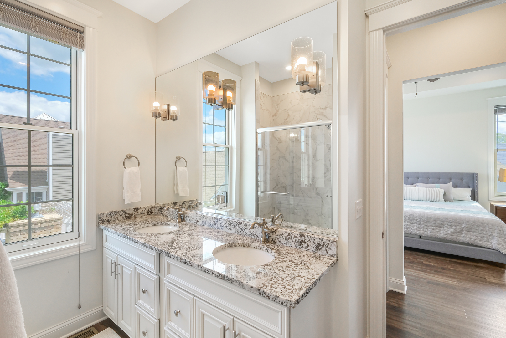 8 Port Place Ottawa, IL 61350 - Photo 12 of 35 a bathroom with a granite countertop sink and a mirror