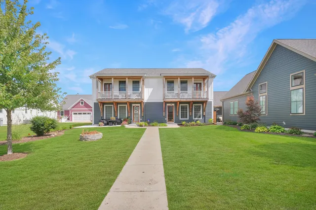 a front view of a house with a yard