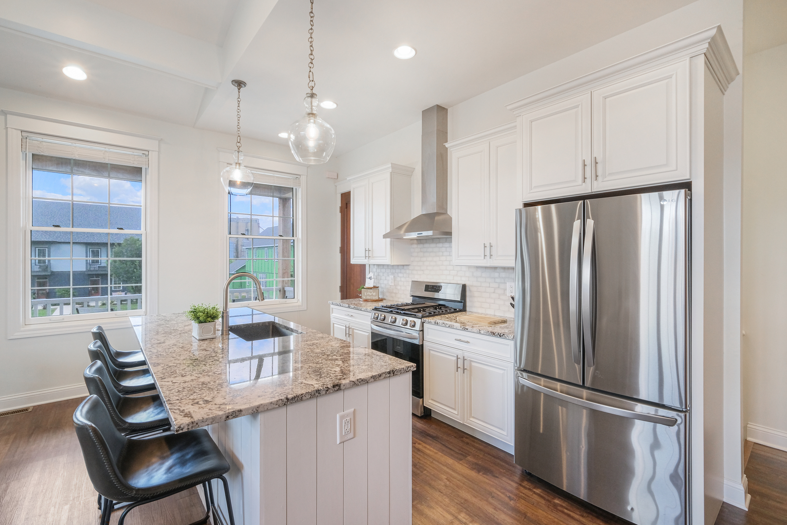 8 Port Place Ottawa, IL 61350 - Photo 4 of 35 a kitchen with stainless steel appliances granite countertop a refrigerator a sink dishwasher a stove and white countertops with wooden floor