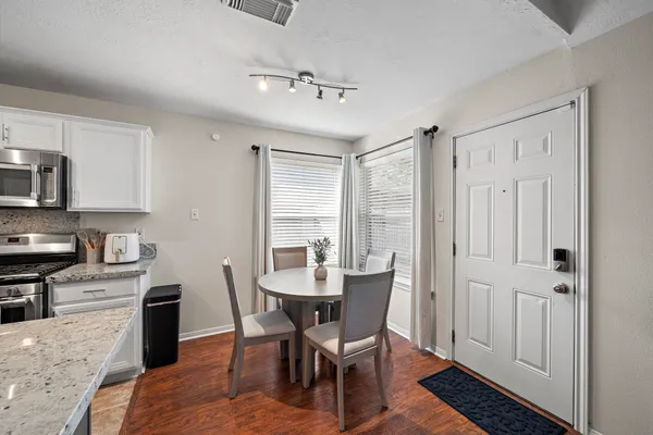 a view of a dining room with furniture