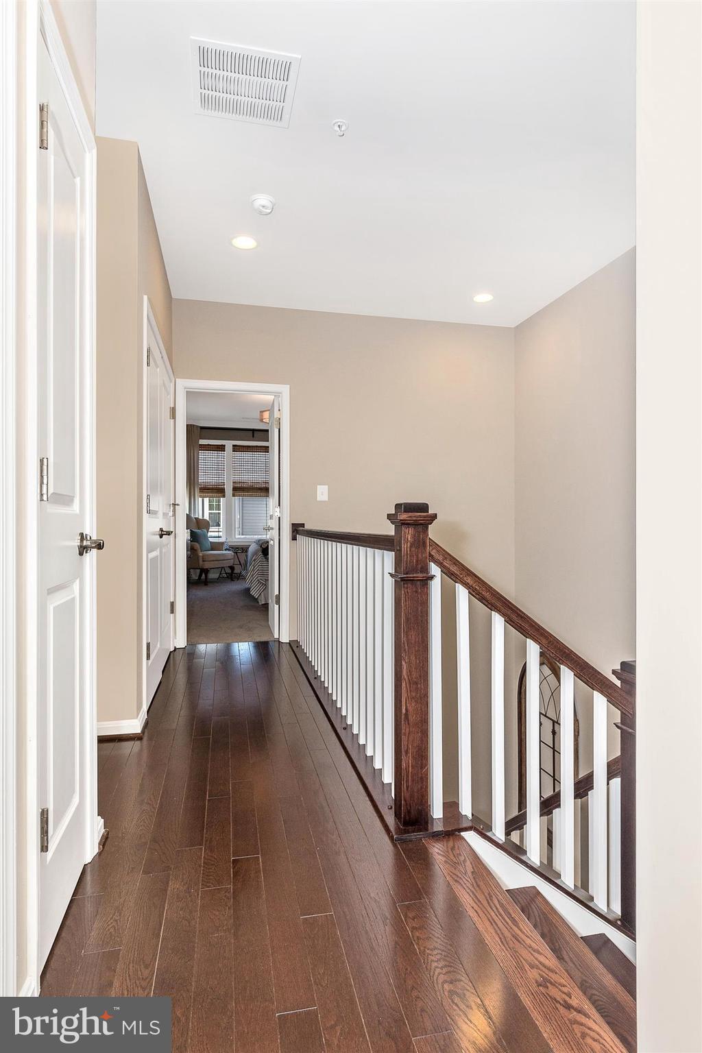 1149 Holden Road Frederick, MD 21701 - Photo 14 of 28 a view of a hallway with wooden floor and stairs