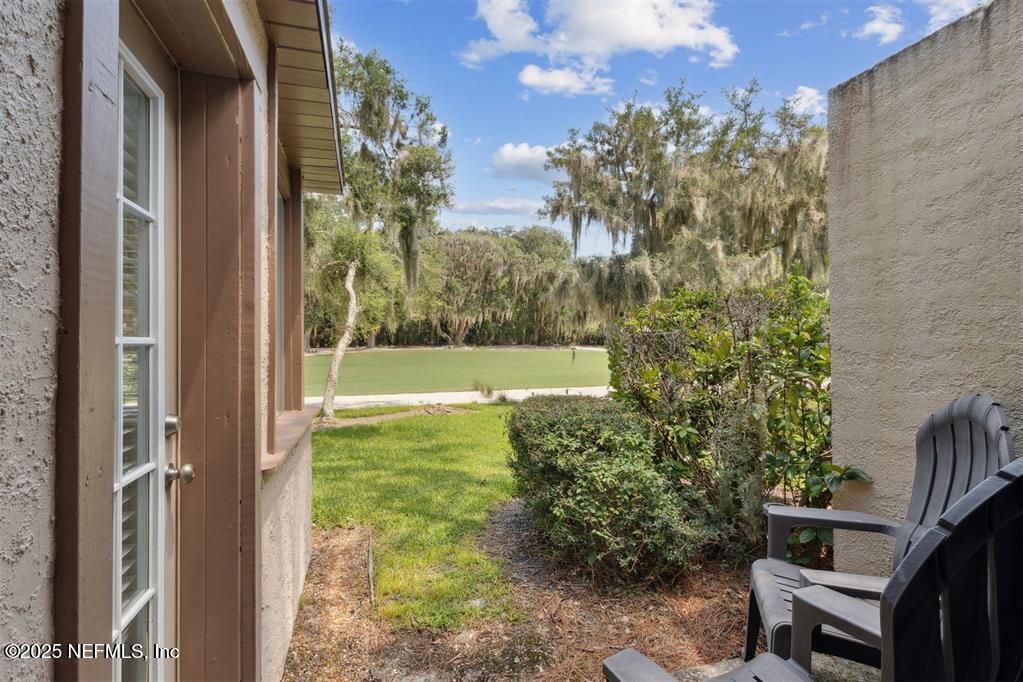 3328 Sea Marsh Road Fernandina Beach, FL 32034 - Photo 30 of 44 a view of backyard with garden