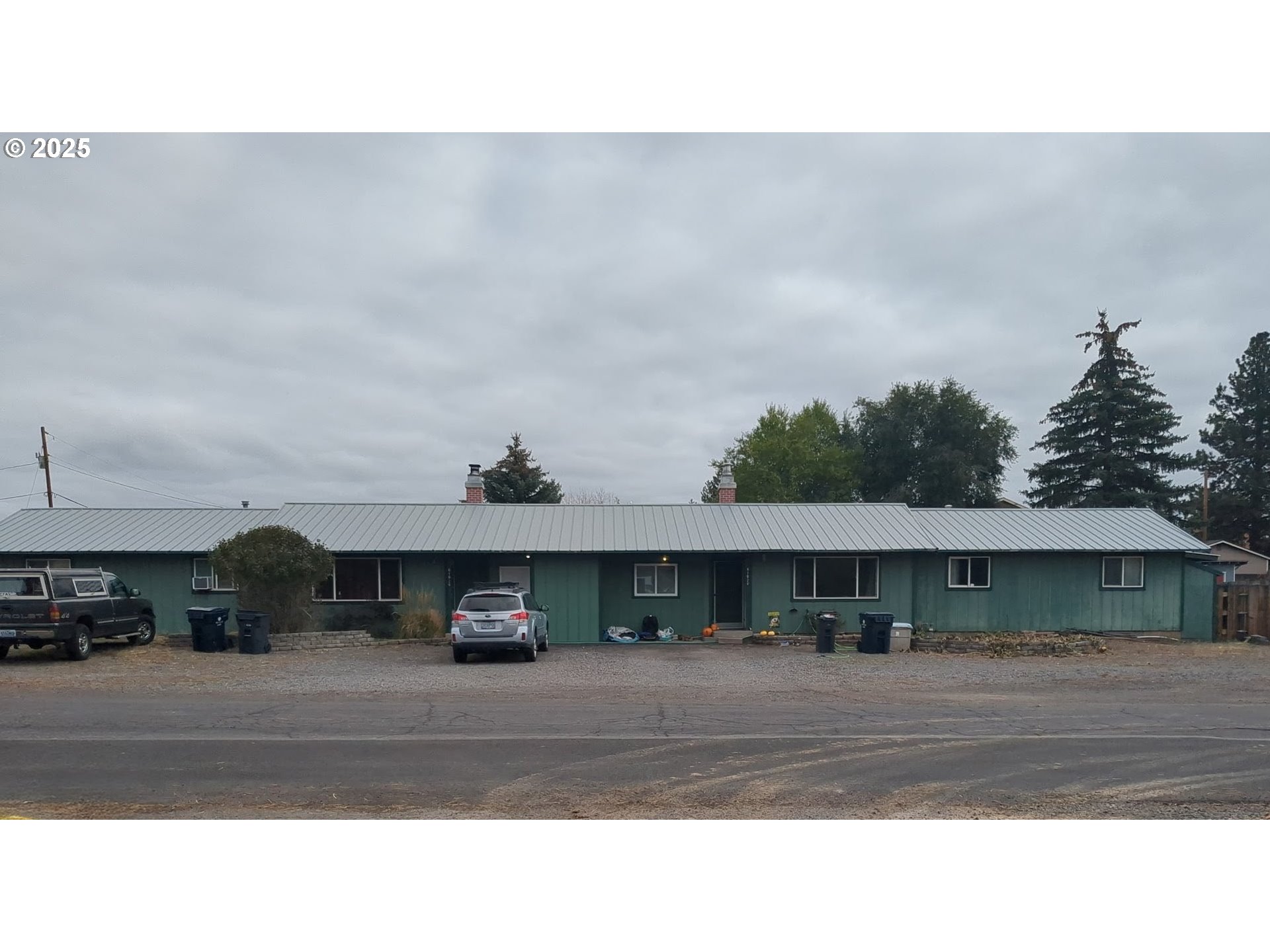 61620 Daly Estates Drive Bend, OR 97702 - Photo 1 of 5 a front view of a house with a yard