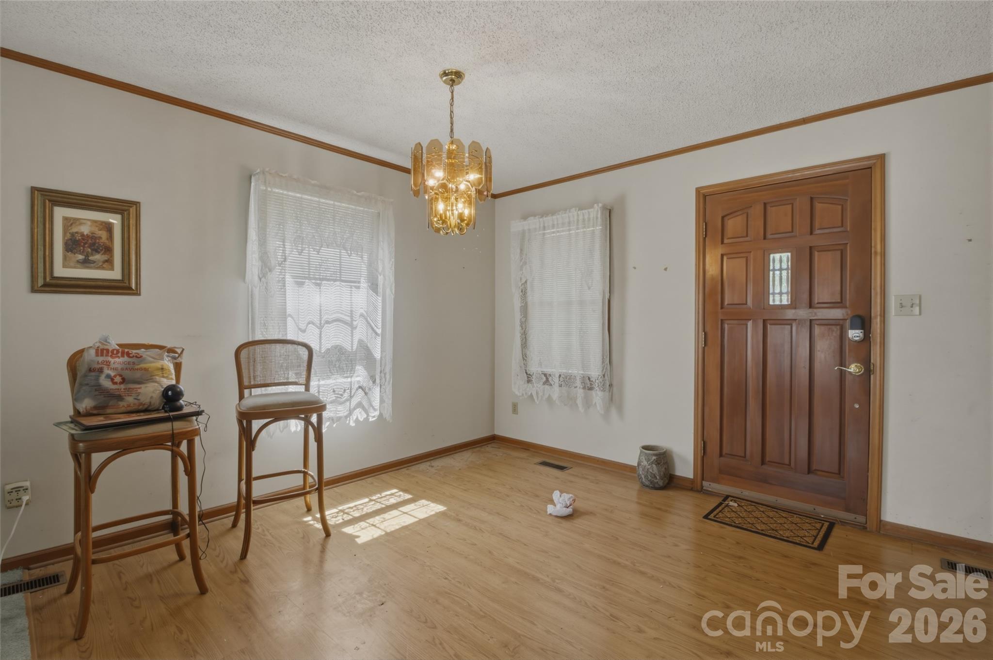 8226 Normandy Road Denver, NC 28037 - Photo 17 of 29 a view of a livingroom with furniture and chandelier