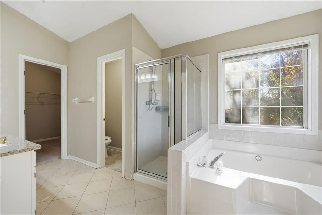 3070 Bugle Drive Duluth, GA 30096 - Photo 23 of 43 a bathroom with a bathtub and a shower