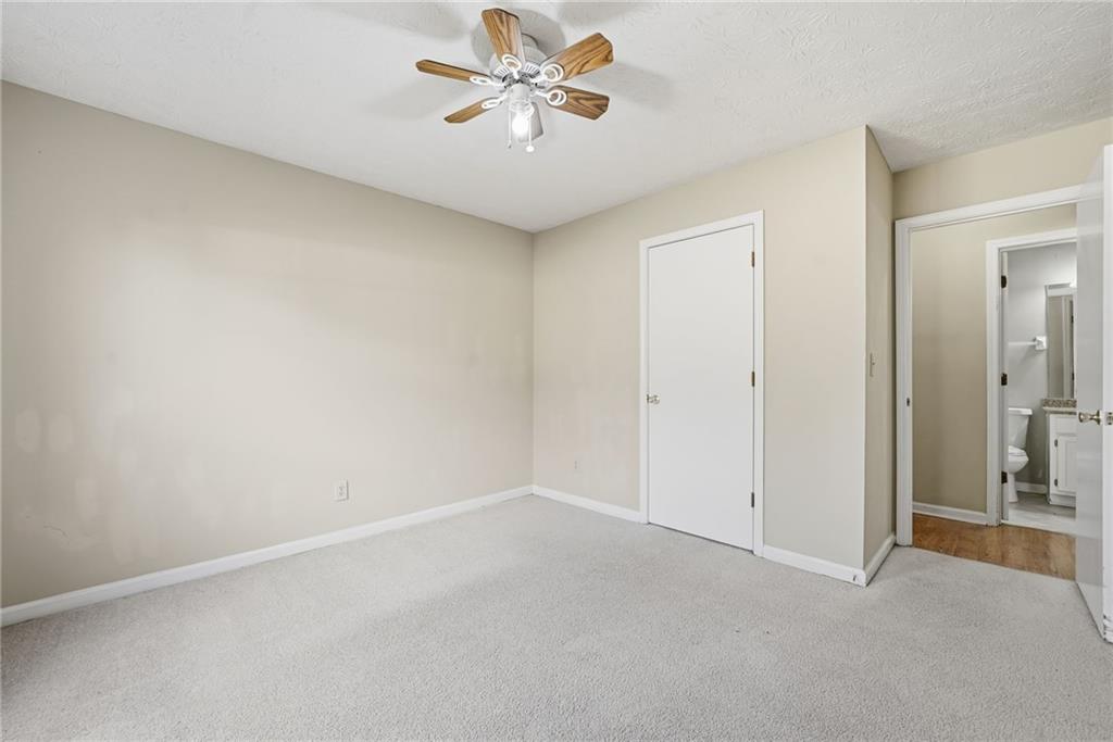 3070 Bugle Drive Duluth, GA 30096 - Photo 28 of 43 an empty room with chandelier fan