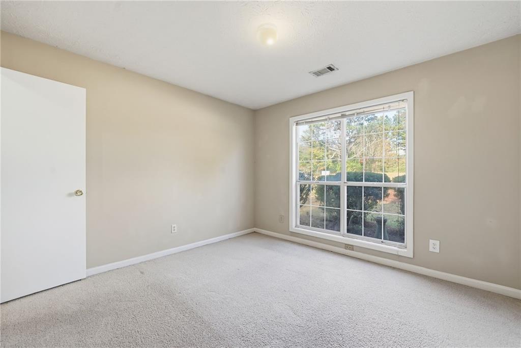 3070 Bugle Drive Duluth, GA 30096 - Photo 31 of 43 a view of an empty room with a window