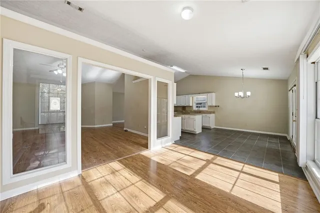 a large bathroom with a glass door shower and a sink