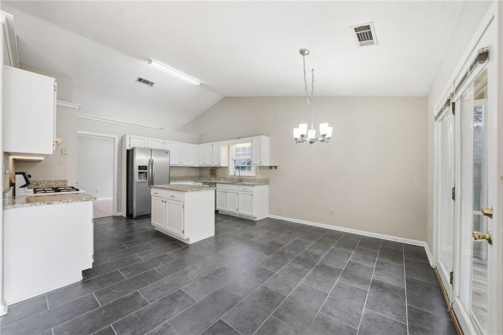 3070 Bugle Drive Duluth, GA 30096 - Photo 10 of 43 a kitchen with a stove a refrigerator and cabinets