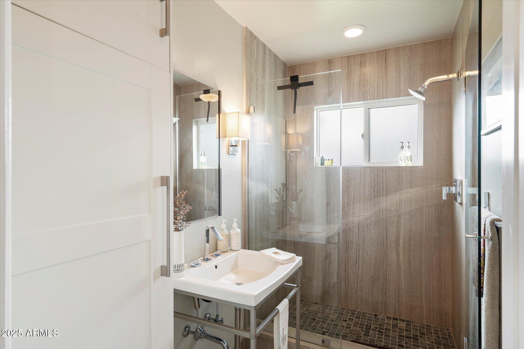 3328 East Turney Avenue Phoenix, AZ 85018 - Photo 13 of 35 a bathroom with a sink shower and a mirror