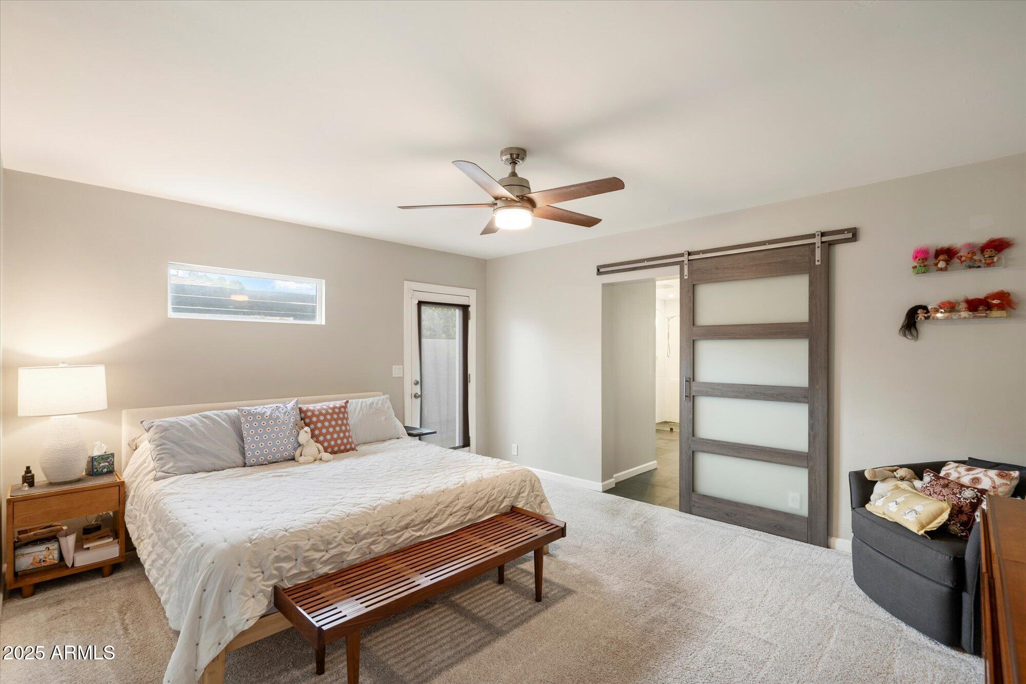 3328 East Turney Avenue Phoenix, AZ 85018 - Photo 14 of 35 a bedroom with a bed and a chandelier