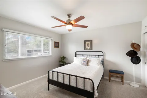 a bathroom with a tub a sink and a mirror
