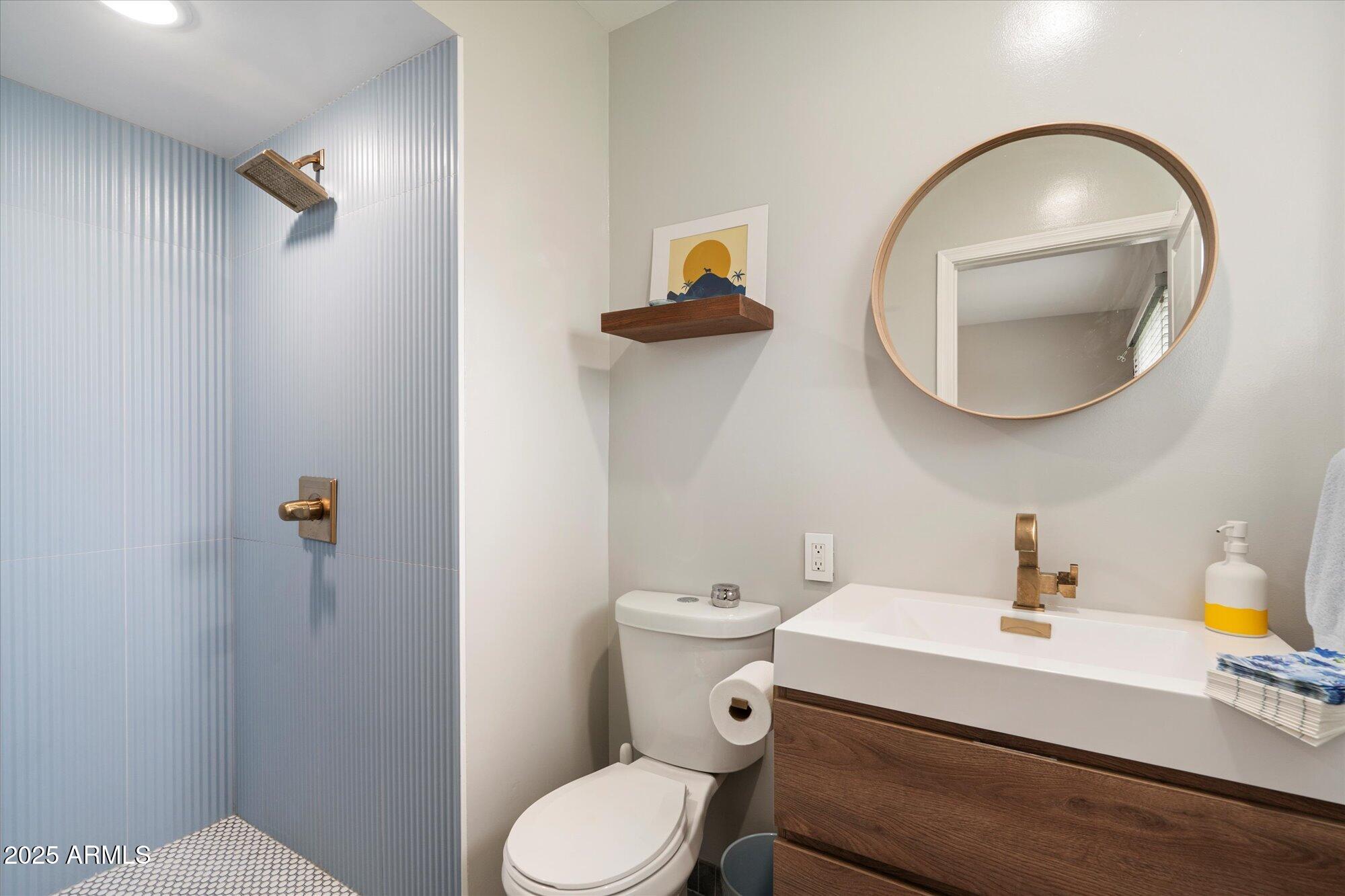 3328 East Turney Avenue Phoenix, AZ 85018 - Photo 19 of 35 a bathroom with a sink mirror and toilet