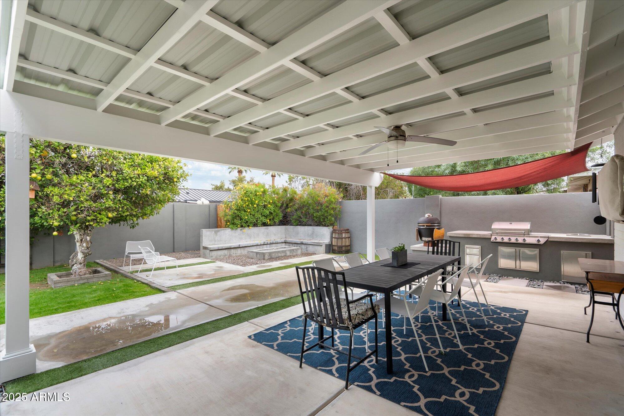3328 East Turney Avenue Phoenix, AZ 85018 - Photo 21 of 35 a patio with a table and chairs