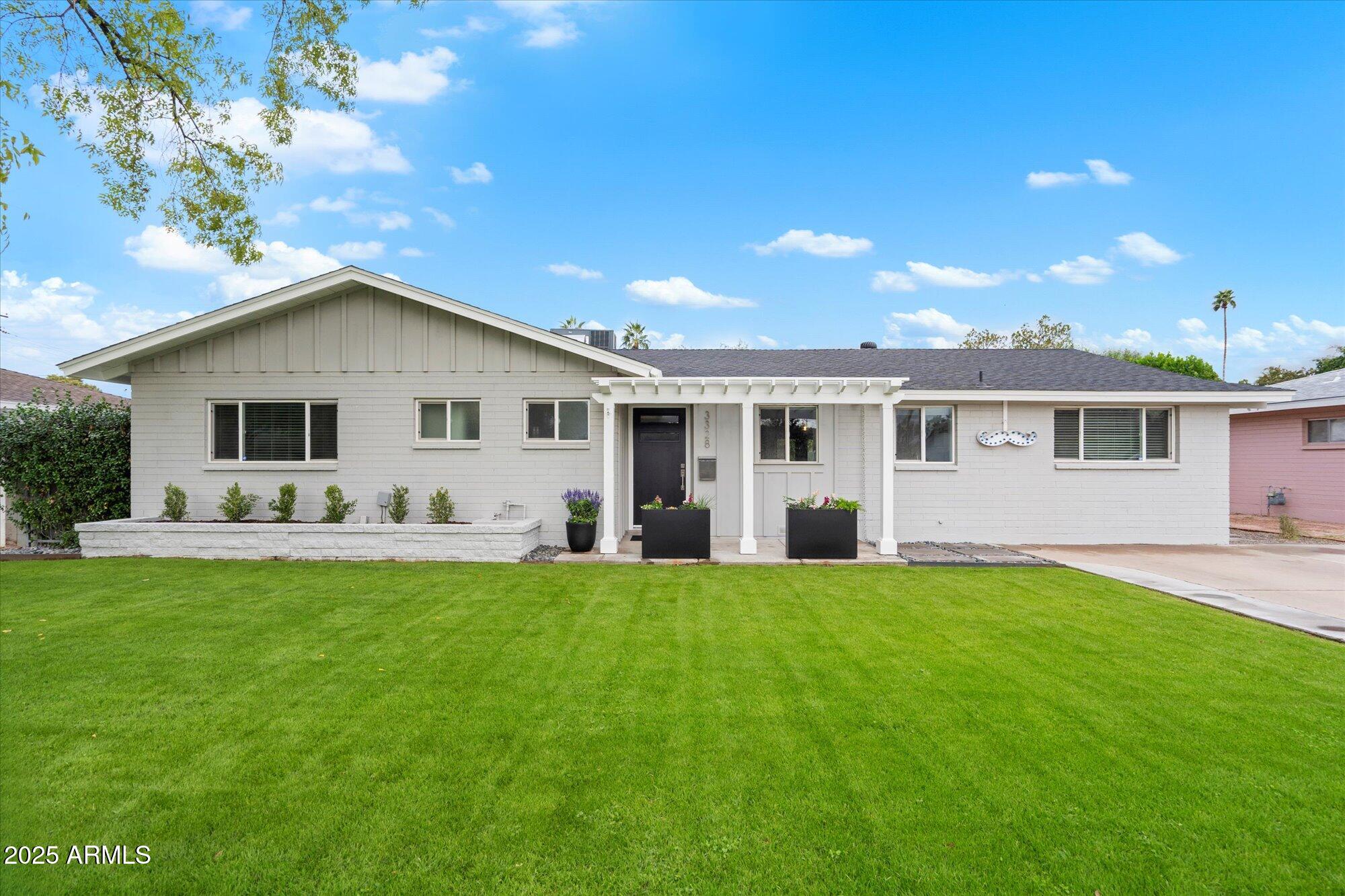 3328 East Turney Avenue Phoenix, AZ 85018 - Photo 2 of 35 a front view of house with yard and green space