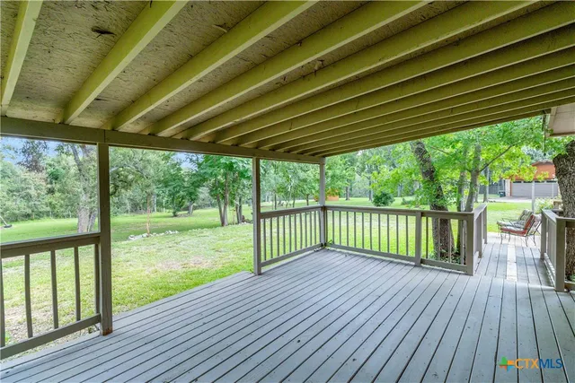 a view of a deck with wooden floor and outdoor space