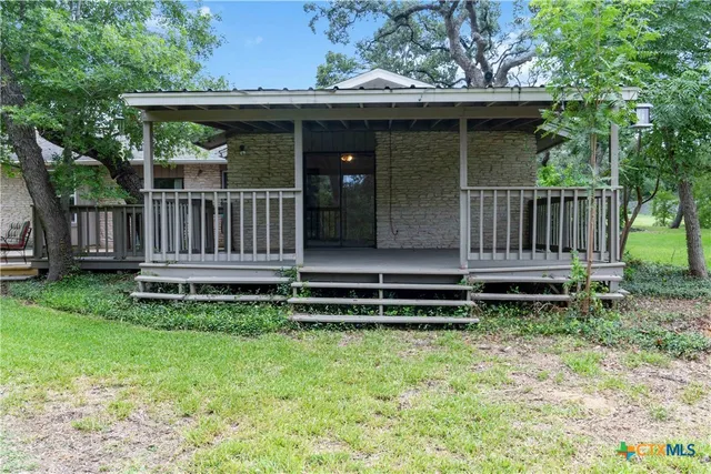 a view of a chair setting in the backyard