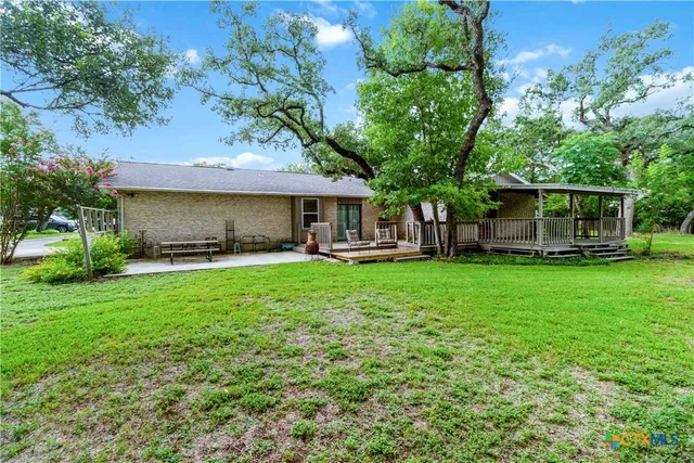 a house view with a garden space