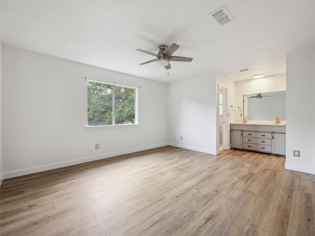 4525 Langtry Lane Austin, TX 78749 - Photo 14 of 31 wooden floor in an empty room with a window
