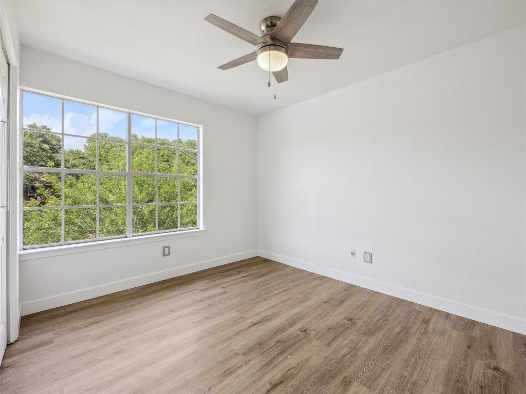 4525 Langtry Lane Austin, TX 78749 - Photo 17 of 31 wooden floor in an empty room with a window