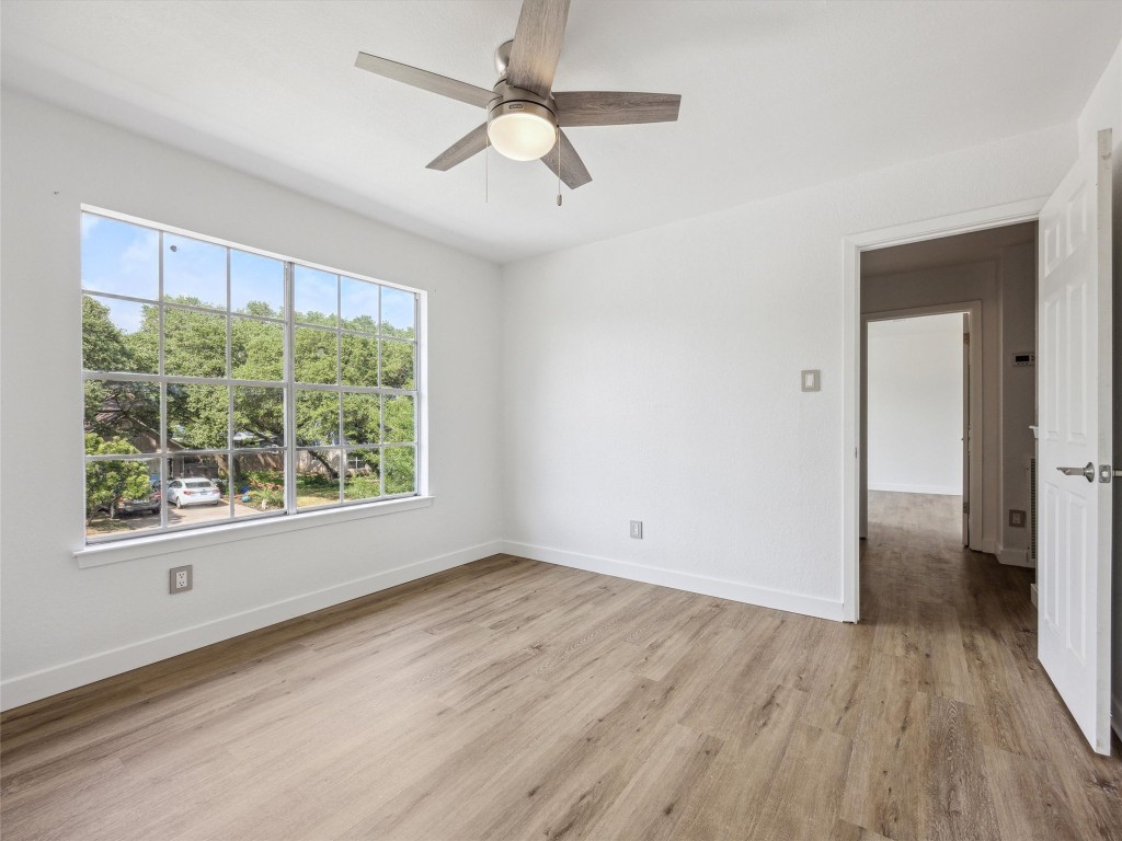 4525 Langtry Lane Austin, TX 78749 - Photo 18 of 31 a view of empty room with wooden floor and fan