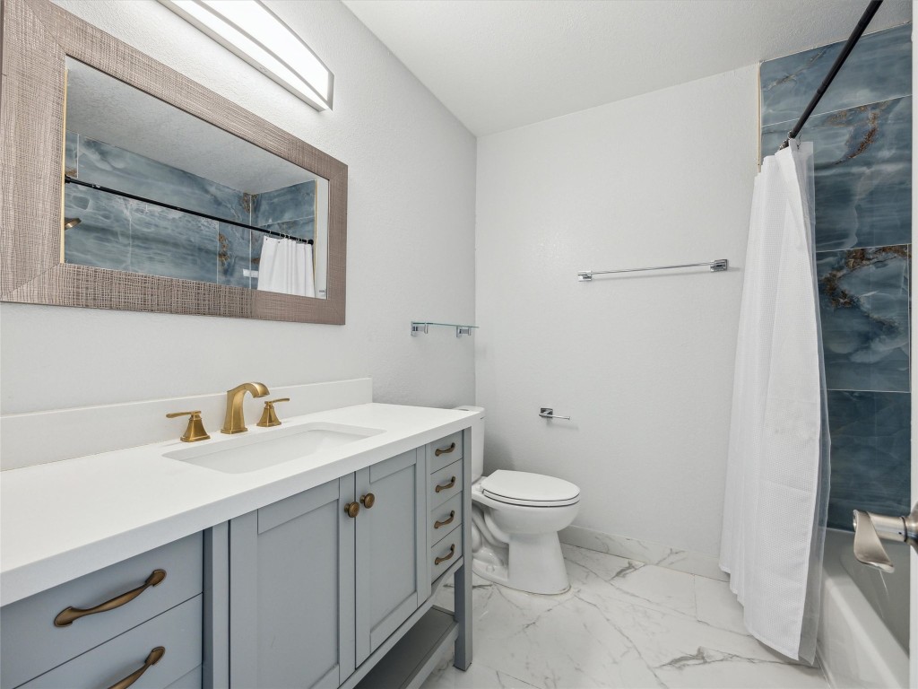 4525 Langtry Lane Austin, TX 78749 - Photo 19 of 31 a bathroom with a sink toilet and vanity
