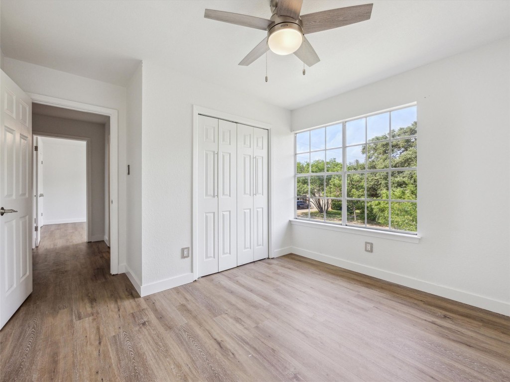 4525 Langtry Lane Austin, TX 78749 - Photo 20 of 31 a view of an empty room with a window and wooden floor