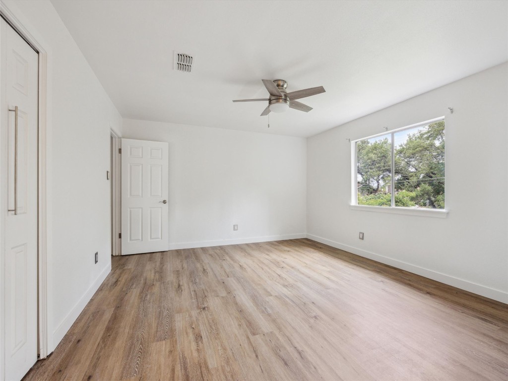 4525 Langtry Lane Austin, TX 78749 - Photo 21 of 31 a view of empty room with wooden floor and fan