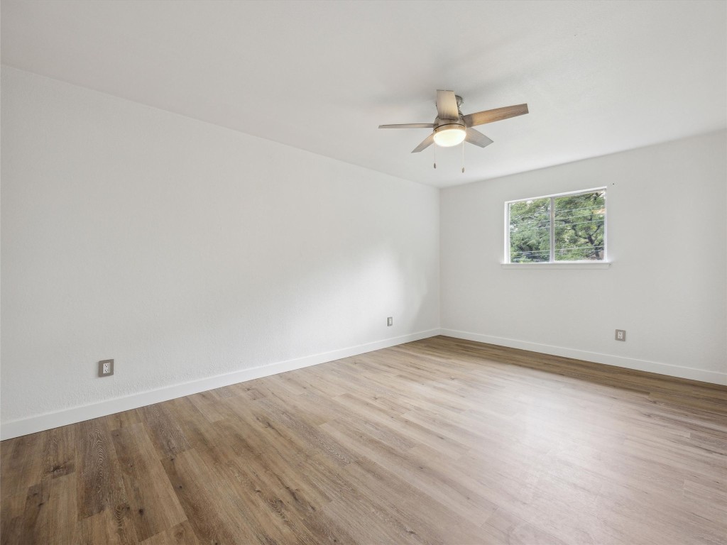 4525 Langtry Lane Austin, TX 78749 - Photo 22 of 31 an empty room with a window and a ceiling fan