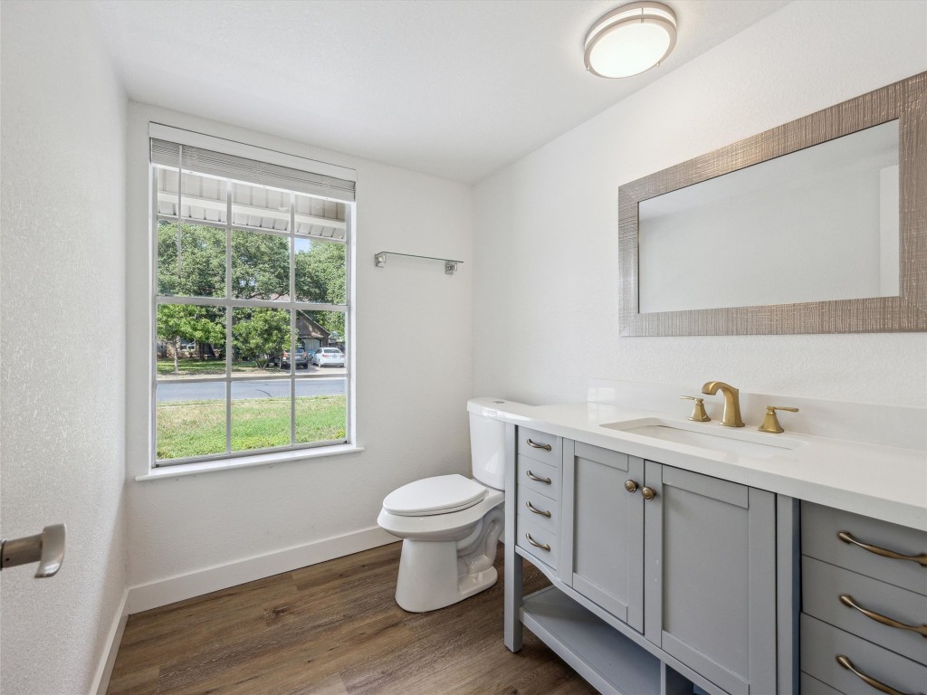 4525 Langtry Lane Austin, TX 78749 - Photo 24 of 31 a bathroom with a toilet sink and mirror