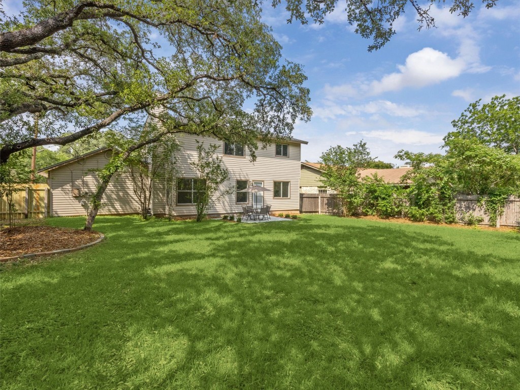 4525 Langtry Lane Austin, TX 78749 - Photo 26 of 31 a view of a white house with a big yard and large trees