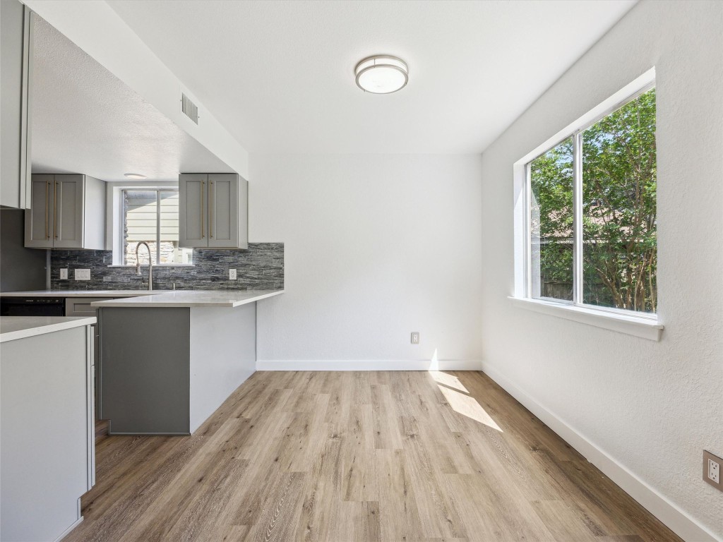 4525 Langtry Lane Austin, TX 78749 - Photo 9 of 31 a kitchen with a hard wood floor window and a sink
