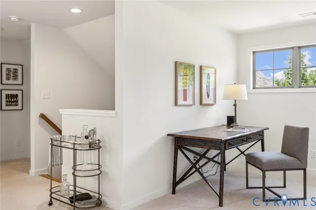 a view of a workspace with furniture