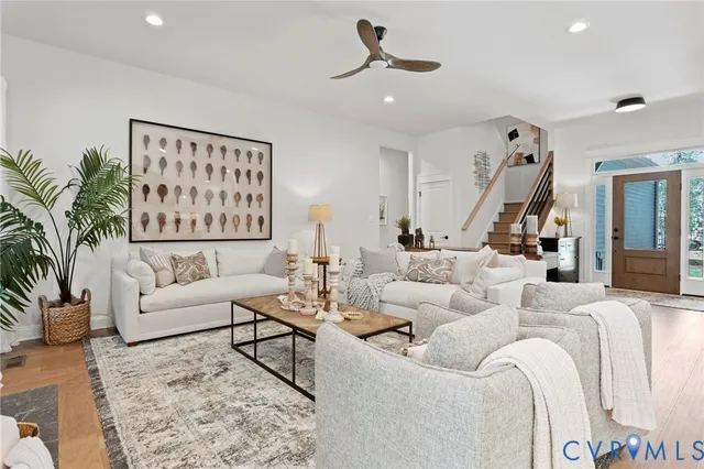 a living room with furniture or couch and a potted plant