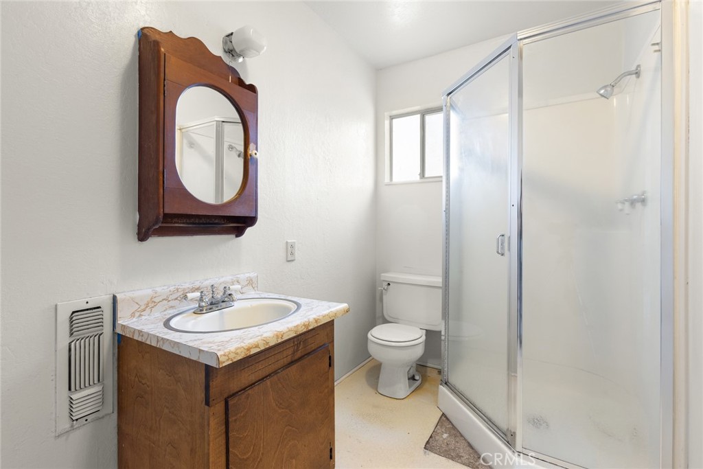 1617 Arcadian Avenue Chico, CA 95926 - Photo 18 of 34 a bathroom with a toilet sink and mirror