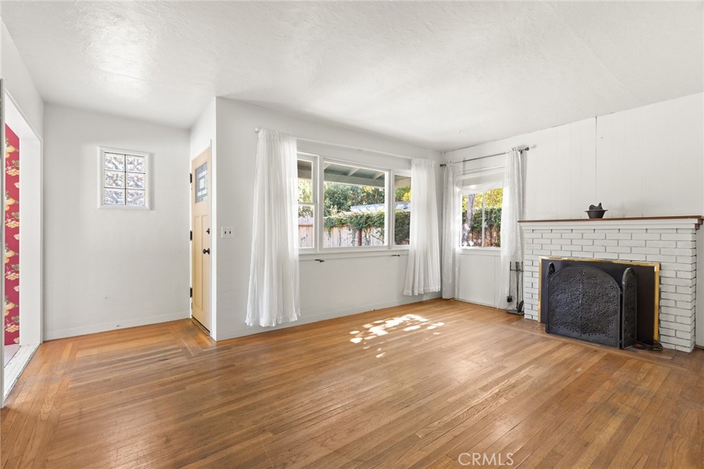 1617 Arcadian Avenue Chico, CA 95926 - Photo 2 of 34 an empty room with windows and fireplace
