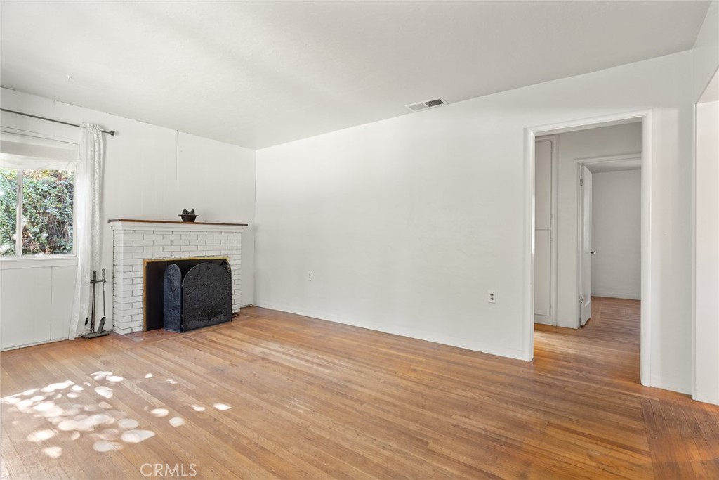 1617 Arcadian Avenue Chico, CA 95926 - Photo 3 of 34 a view of a livingroom with wooden floor and a fireplace