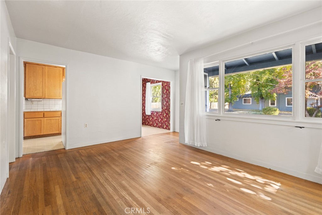 1617 Arcadian Avenue Chico, CA 95926 - Photo 5 of 34 a view of an empty room with wooden floor and a window