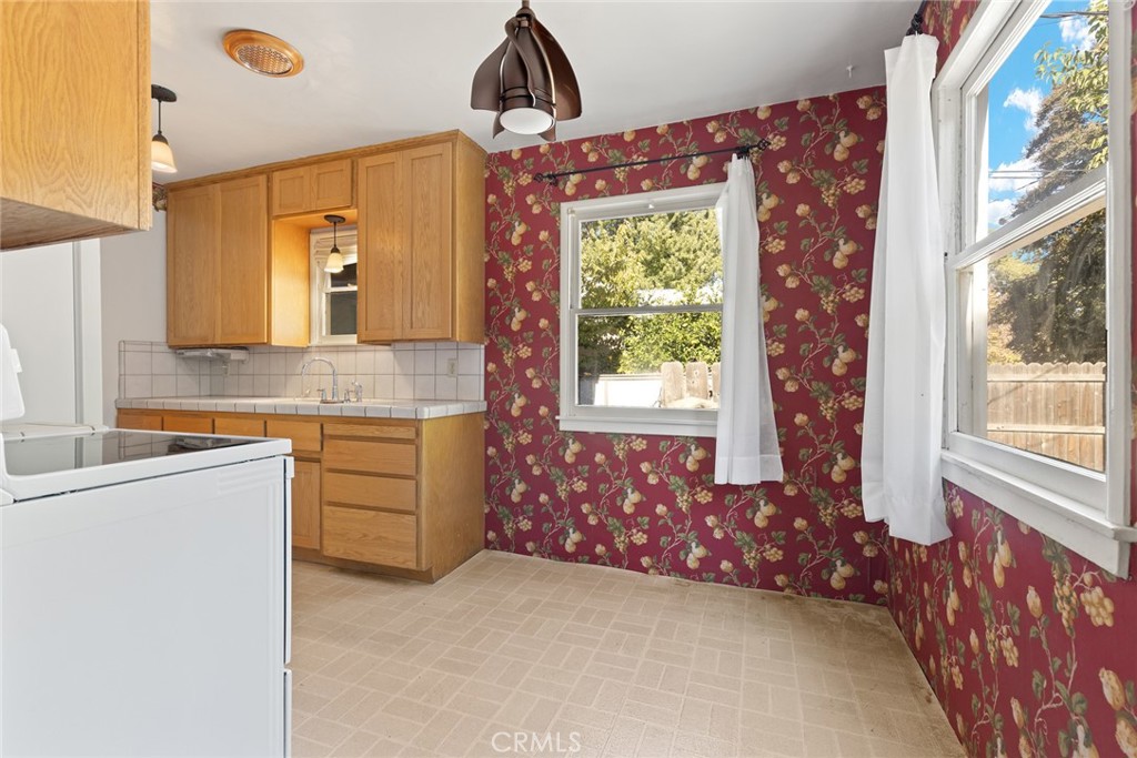 1617 Arcadian Avenue Chico, CA 95926 - Photo 6 of 34 a bathroom with a granite countertop sink and a mirror