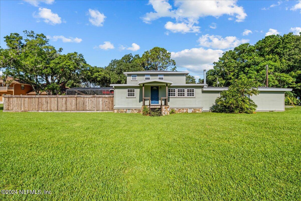 260 Brickyard Road Middleburg, FL 32068 - Photo 2 of 52 a front view of house with yard and outdoor seating