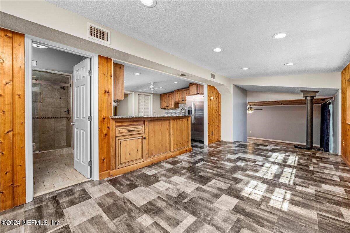 260 Brickyard Road Middleburg, FL 32068 - Photo 21 of 52 a view of a kitchen with a sink and a refrigerator