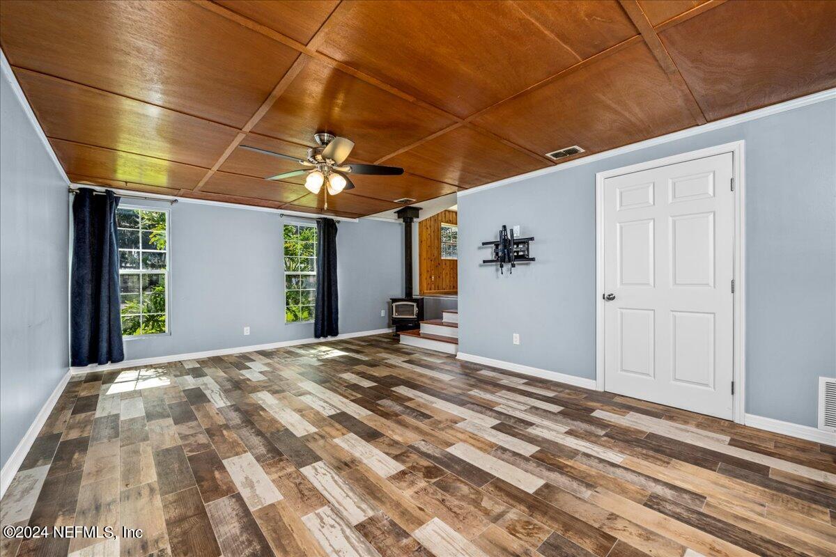 260 Brickyard Road Middleburg, FL 32068 - Photo 23 of 52 a view of a room with a bed and a chandelier