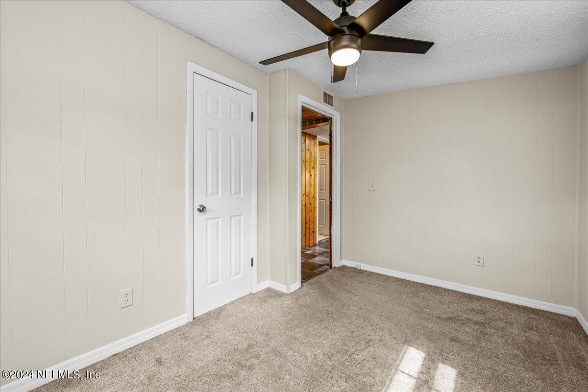 260 Brickyard Road Middleburg, FL 32068 - Photo 30 of 52 an empty room with a ceiling fan and a window