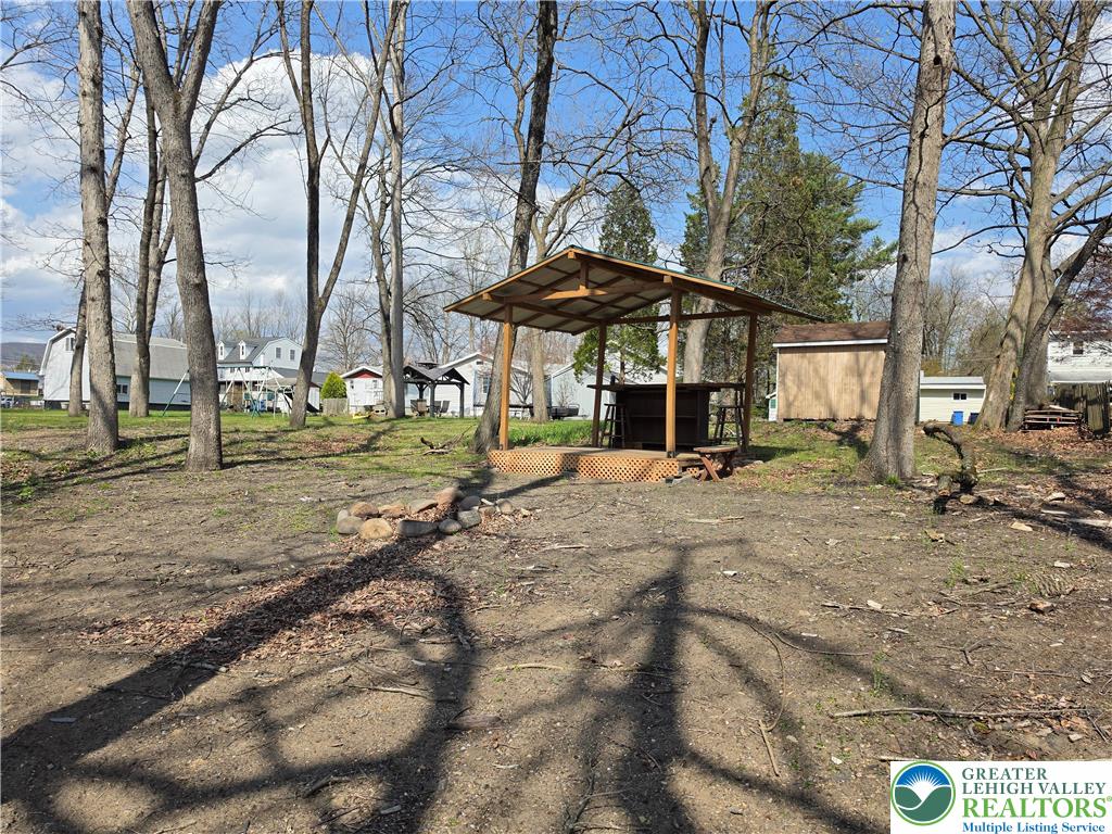 218 Lehigh Street Walnutport, PA 18088 - Photo 6 of 22 a backyard of a house with barbeque oven